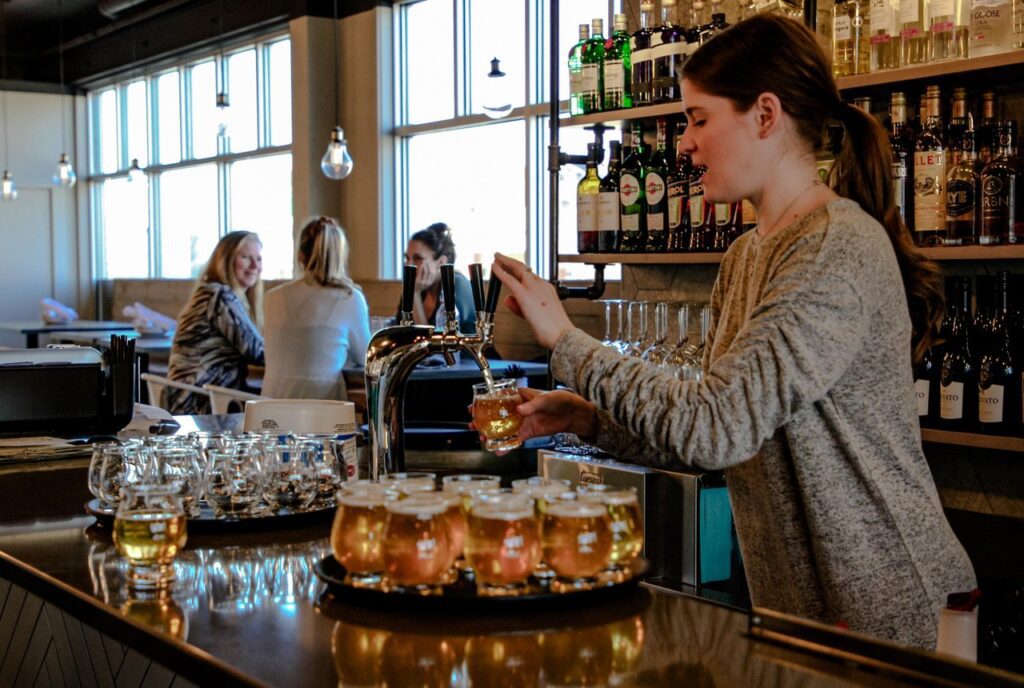 Woman pouring beer